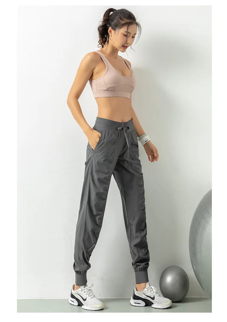 Pantalones deportivos de tela con cordón para correr, de secado rápido, para mujer, para gimnasio, fitness, con bolsillos laterales, para hacer ejercicio.