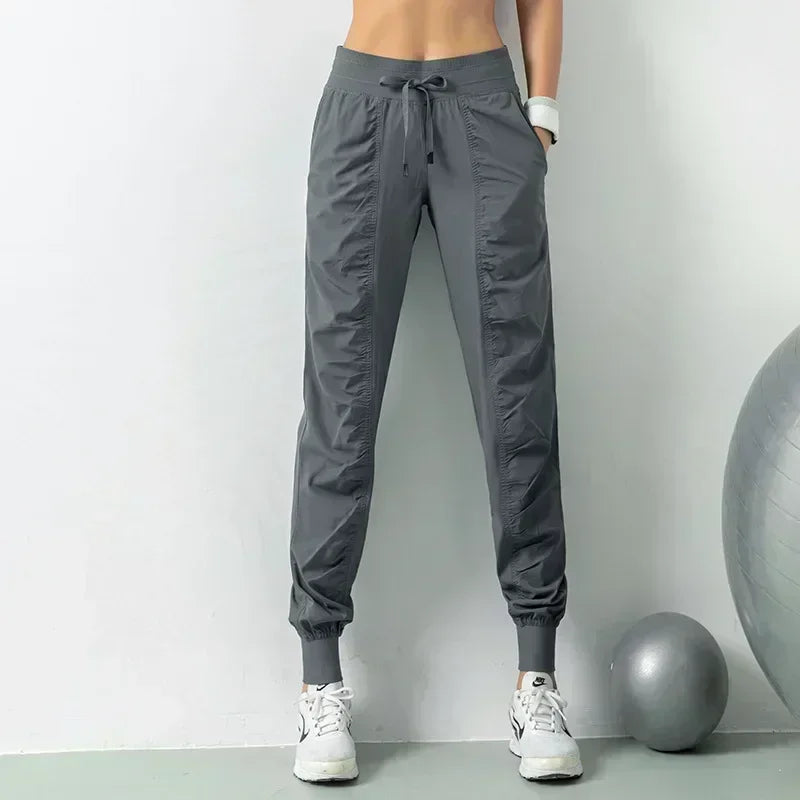 Pantalones deportivos de tela con cordón para correr, de secado rápido, para mujer, para gimnasio, fitness, con bolsillos laterales, para hacer ejercicio.