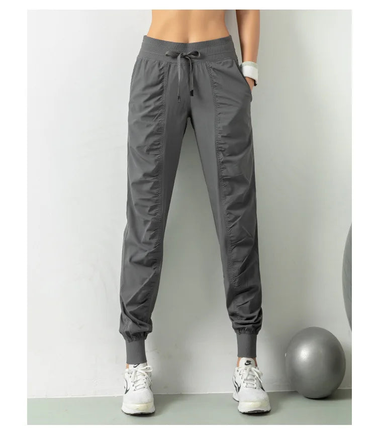 Pantalones deportivos de tela con cordón para correr, de secado rápido, para mujer, para gimnasio, fitness, con bolsillos laterales, para hacer ejercicio.